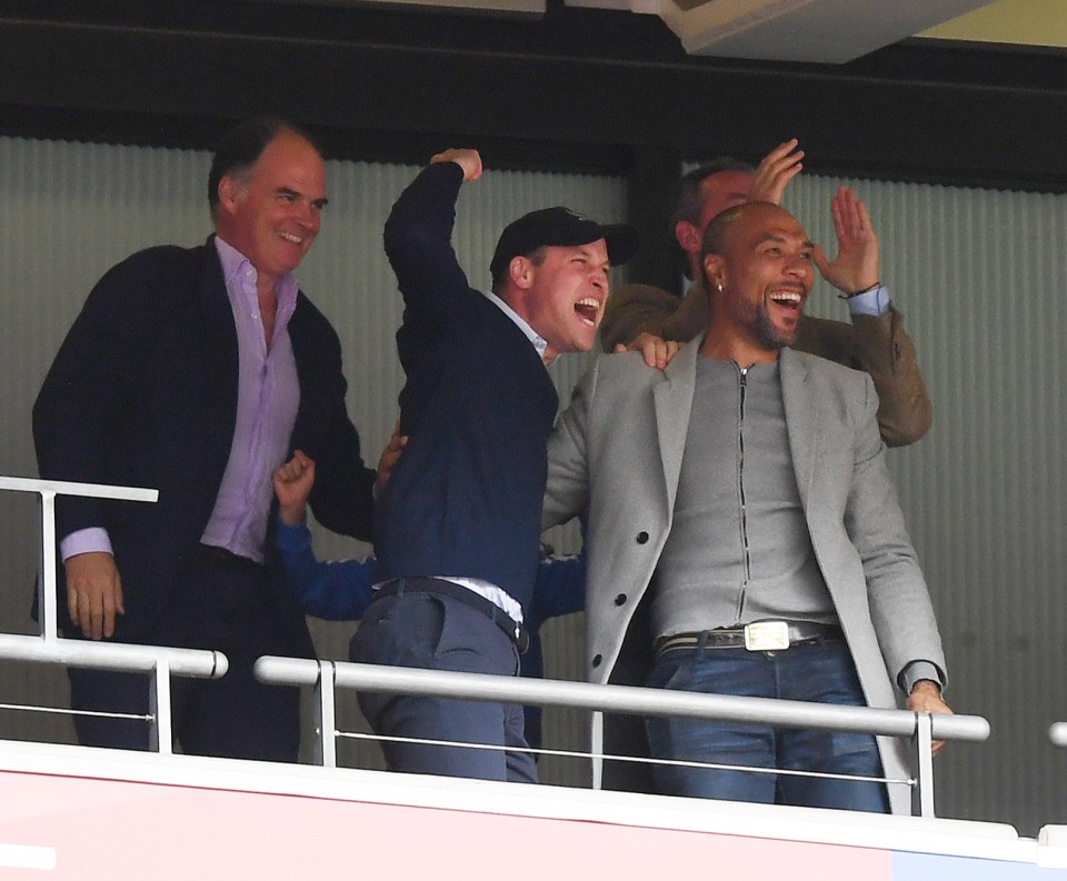 Prince William celebrates with John Carew as Aston Villa return to the Premier League at Wembley