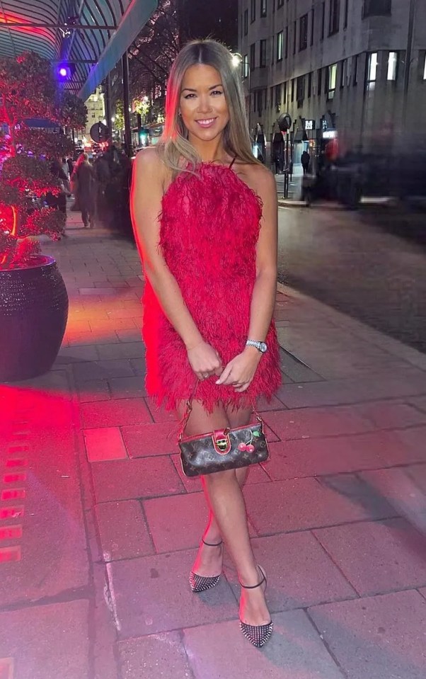 Hollie cuts an elegant figure in a stunning red dress