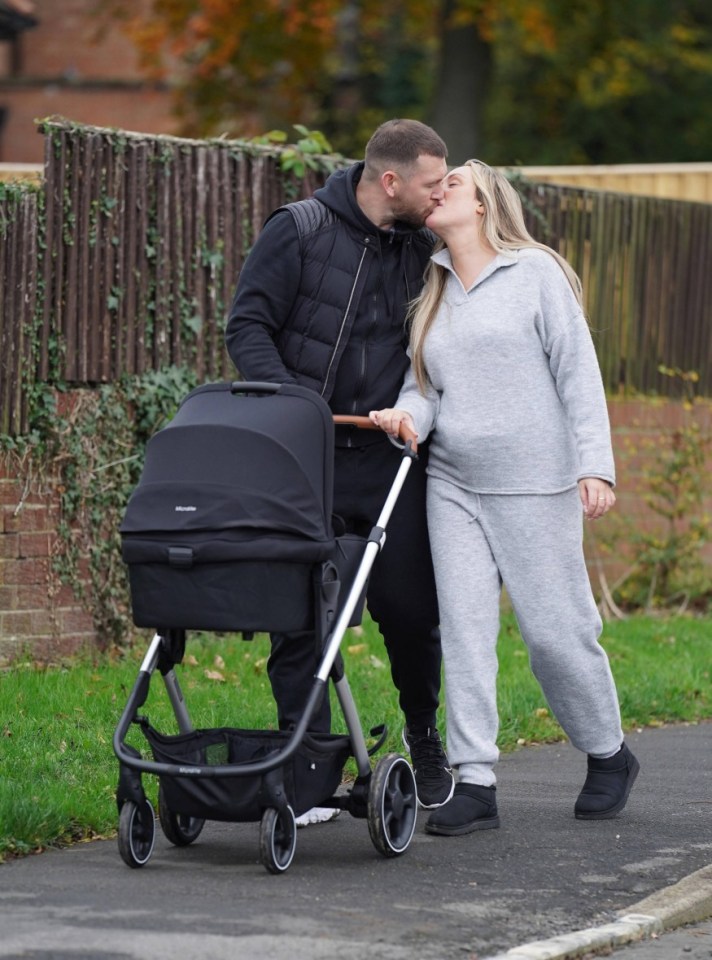 The happy couple shared a kiss on their walk