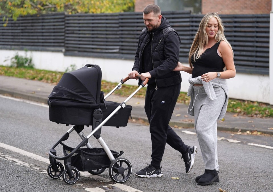 New mum Charlotte looked great during the walk while proud dad Jake pushed the pram