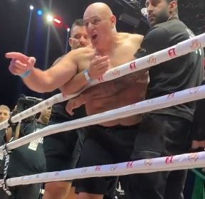 A furious John Fury had to be held back from getting to Jake Paul