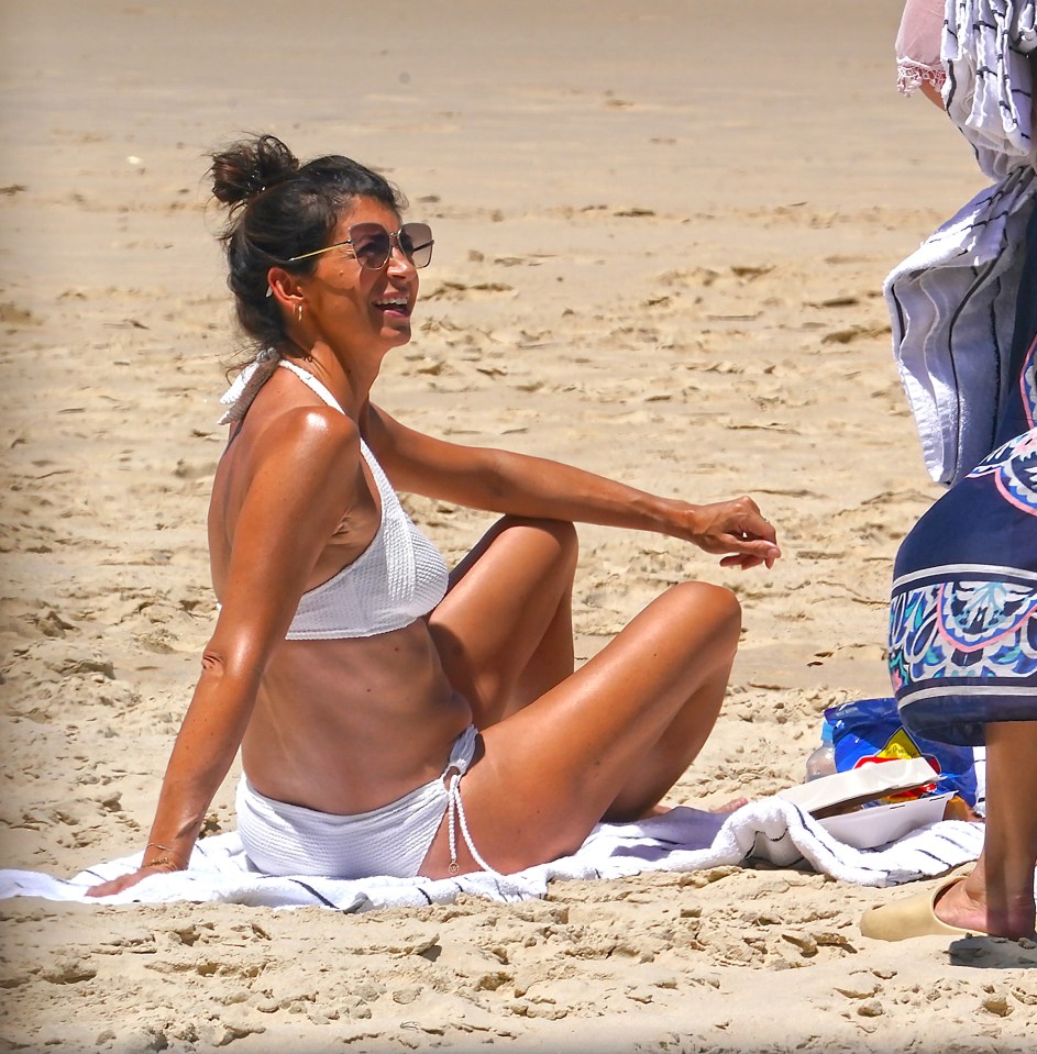 The 45-year-old stunned in a white bikini and sunglasses