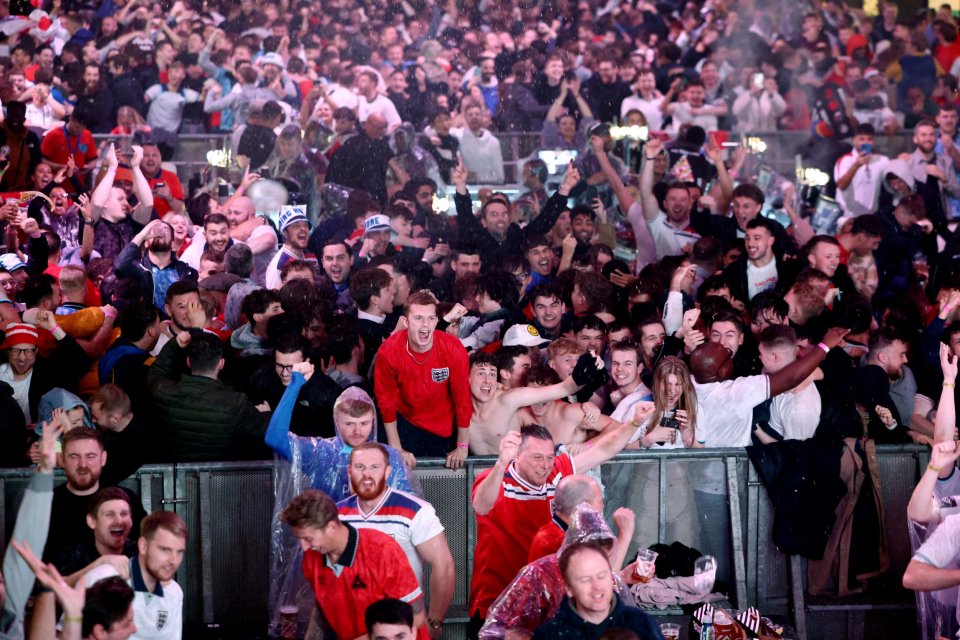 Supporters at Box Park, Wembley, cheer and hug their mates after a goal