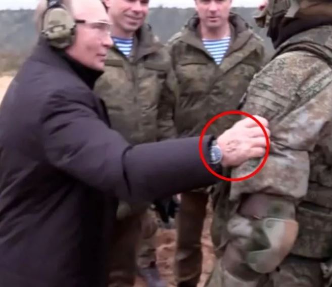 Putin pictured with suspected track marks from IV treatment on the back of his hand