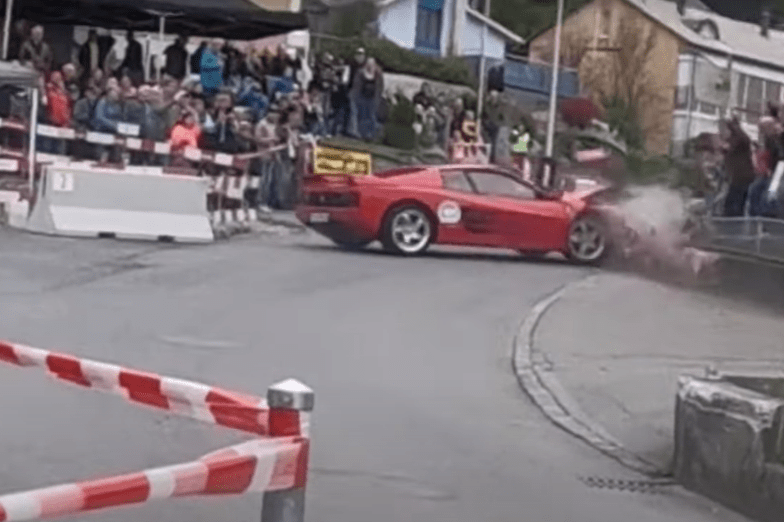 This is the moment the £200k classic Ferrari smashes into a low wall