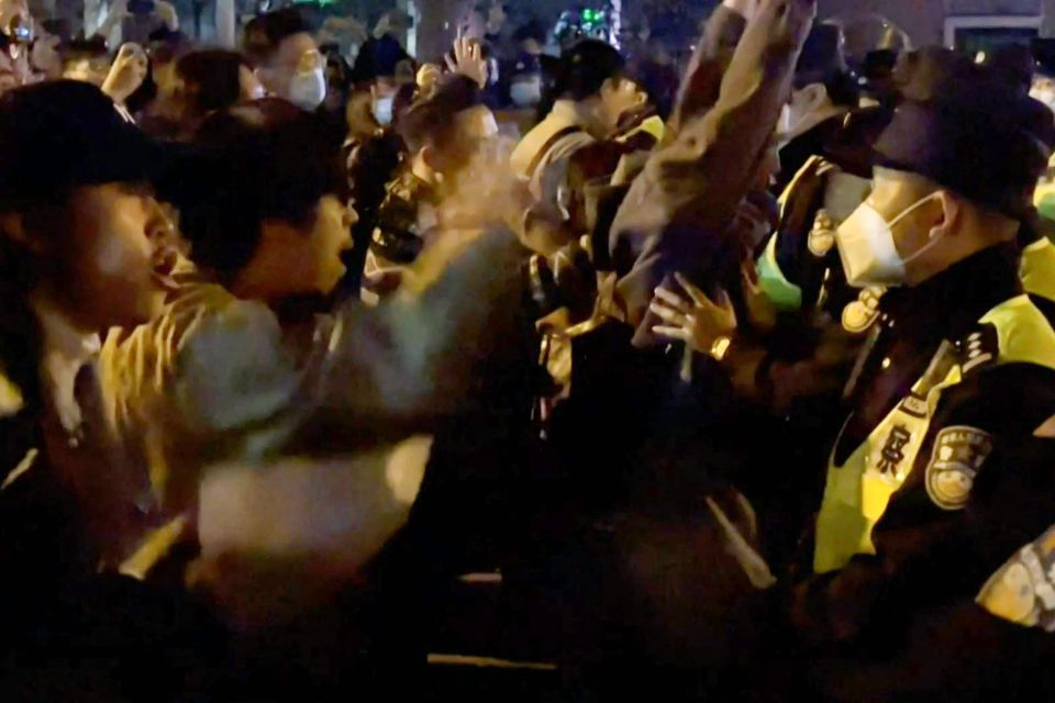 Protesters have clashed with cops as fury spills out onto the streets in China