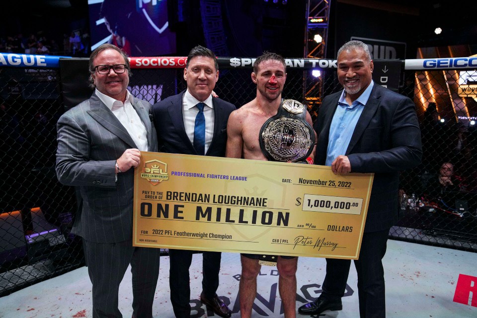 Brendan Loughnane celebrates with his m cheque