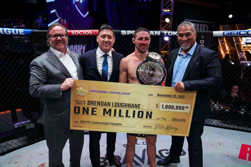 Brendan Loughnane celebrates with his $1m cheque