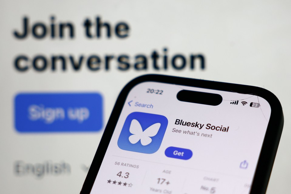 a phone with the bluesky social app open