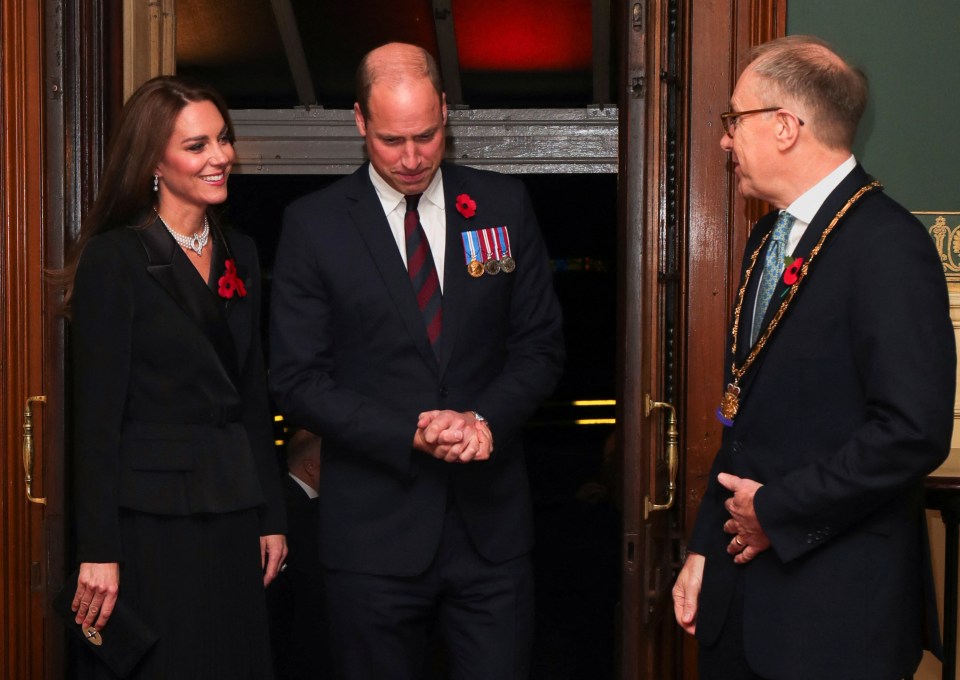 Kate and William are greeted by a host from the Royal British Legion