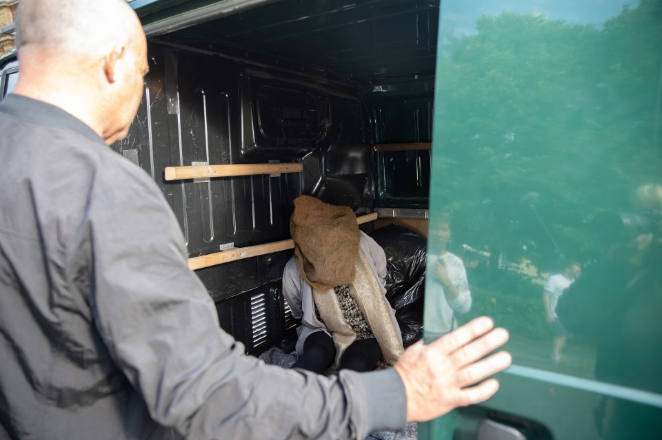 Bernie is bundled into a van