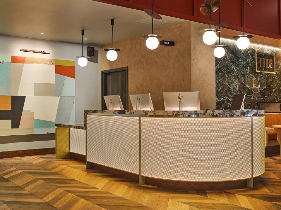 The hotel is modern and stylish, with edgy graphic design and chrome gold lighting