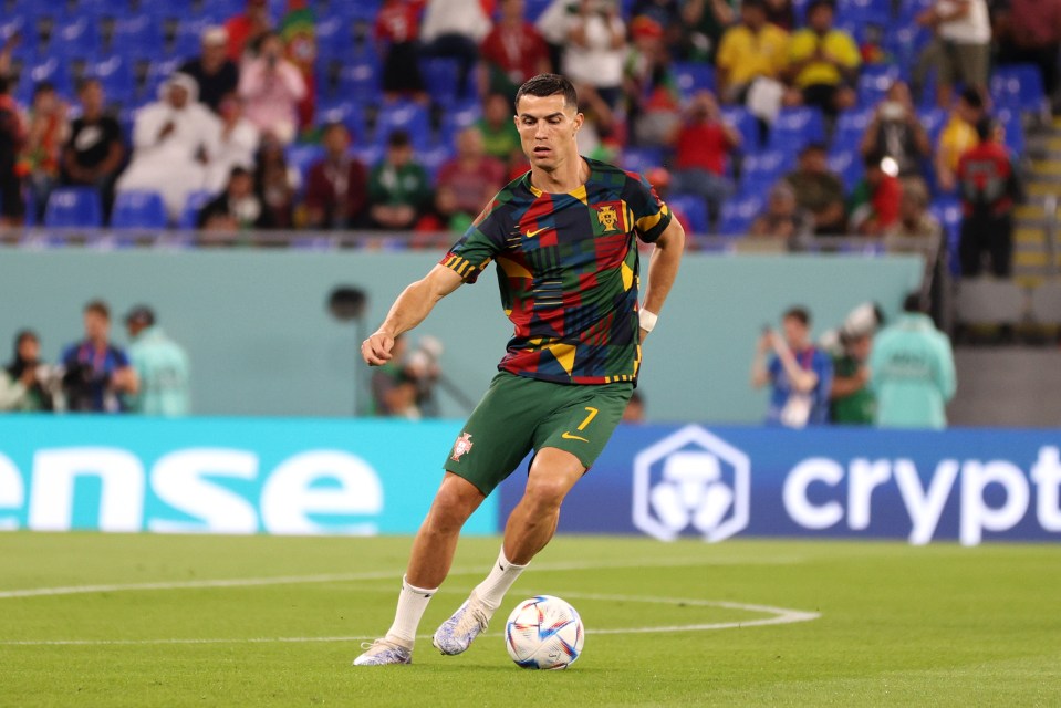 Cristiano Ronaldo warms up ahead of his side's clash with Ghana