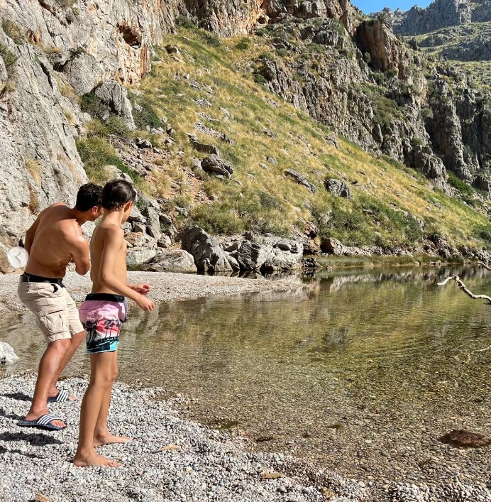 He also skimmed stones with son Harry during their Spanish holiday