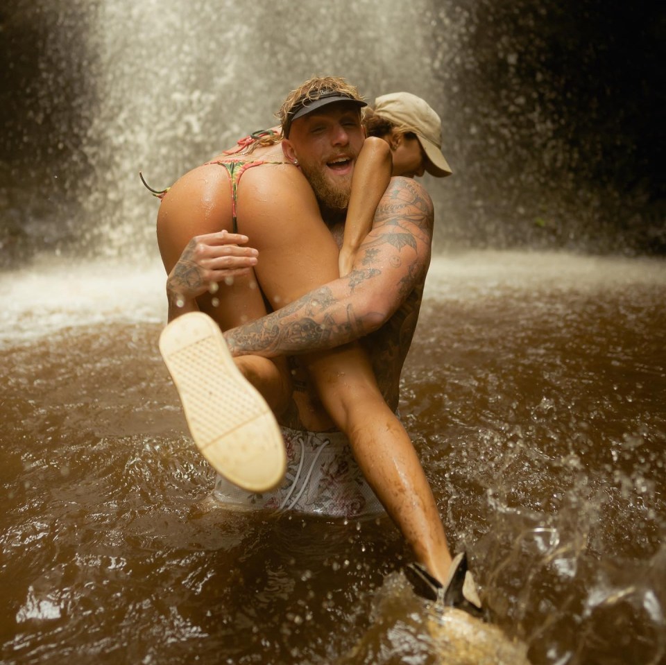 Paul picked up Rose as they were showered by the waterfall