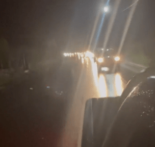 Footage shows convoys of cars heading for higher ground in Tonga