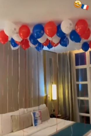 Red, white and blue balloons floated over a comfy bed