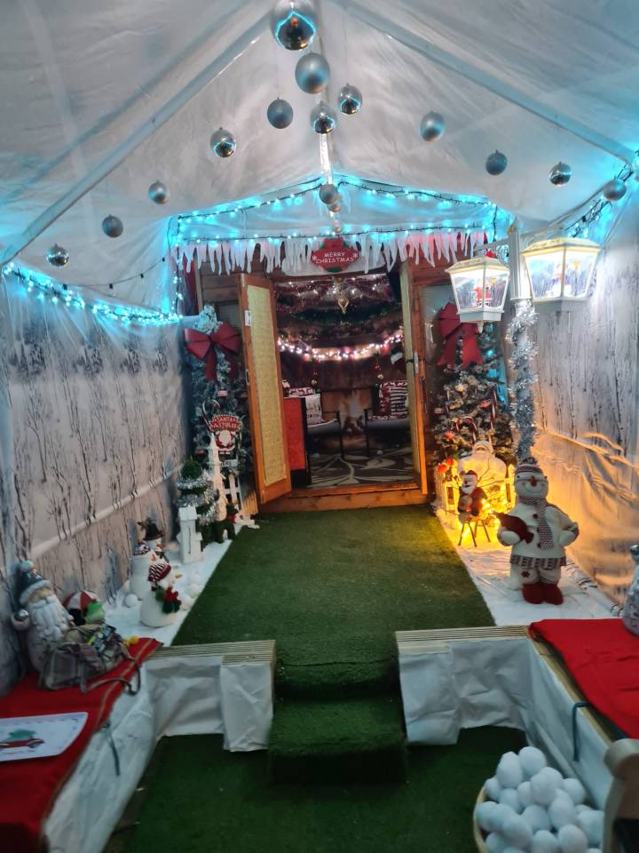 A mum has revealed the incredible Santa's grotto her dad made in the back garden