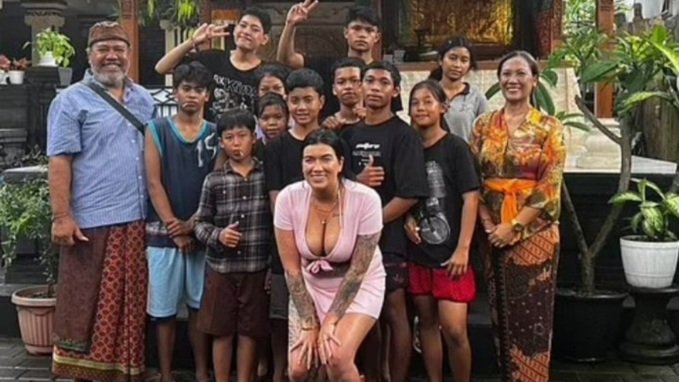 Kelsey Foster, 28, was slammed for wearing a plunging top while visiting the Bali orphanage