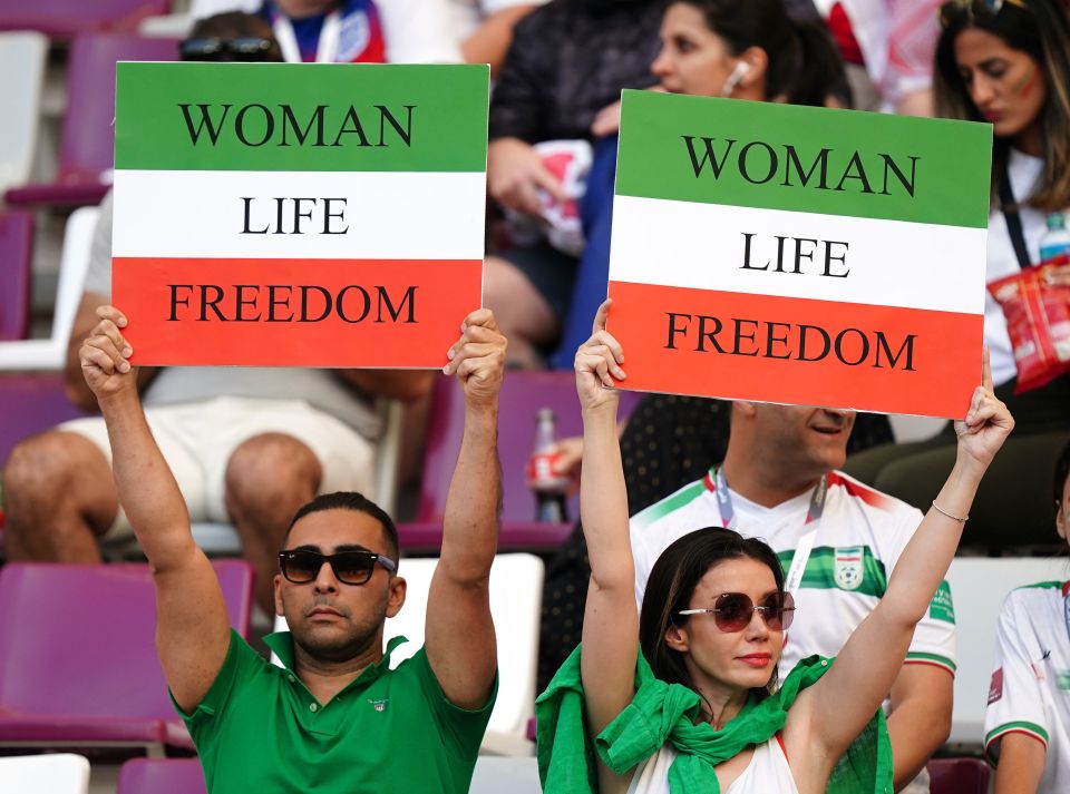 Iran fans held banners supporting the protesters back home