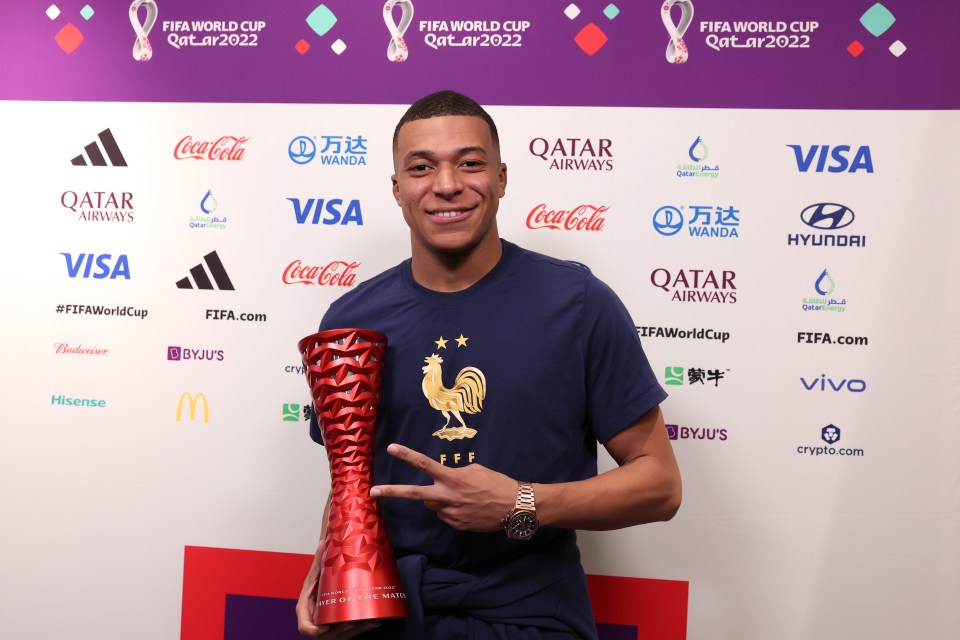 Mbappe shows off his Man of the Match award after his brace against Denmark