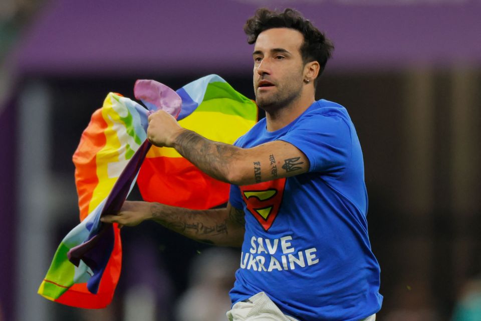 A pitch invader carrying a rainbow flag stopped Portugal's clash with Uruguay