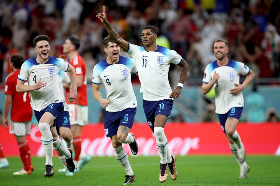 England celebrate after Marcus Rashford opened the scoring against Wales