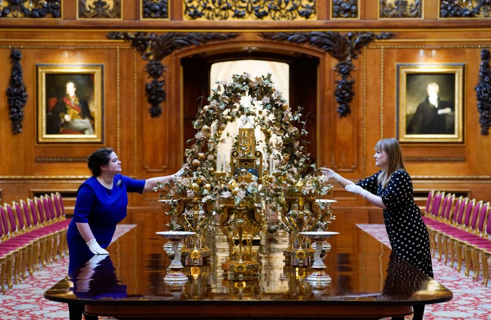 More ornaments are adjusted on a table in the Waterloo Chamber