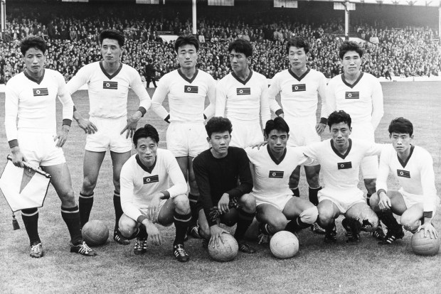 a black and white photo of a korean soccer team