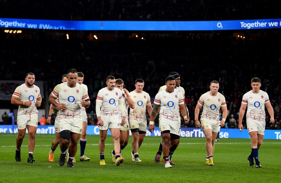 The players walk off the pitch