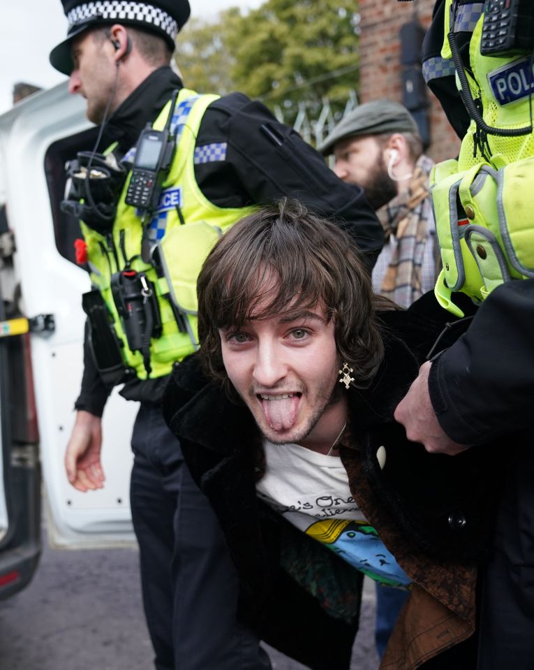 The idiot's tongue was hanging out as police dragged him away