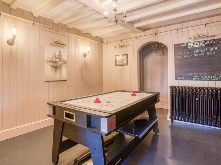 The pub contains a pool table, table tennis, air hockey, a piano and a karaoke machine