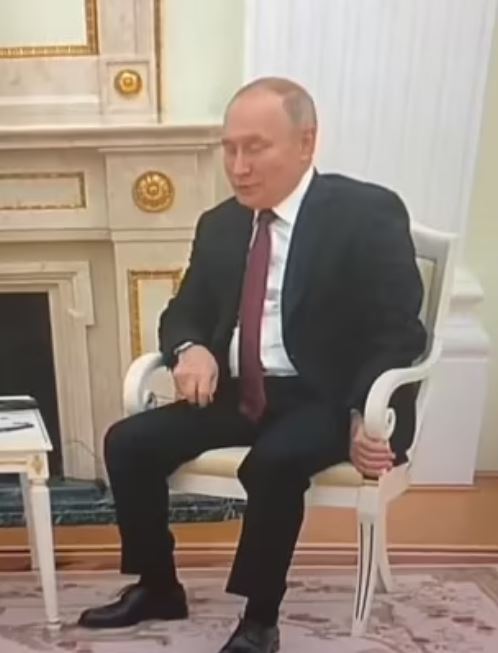 The evil tyrant's erratic posture is unmissable during the awkward televised five-minute chat