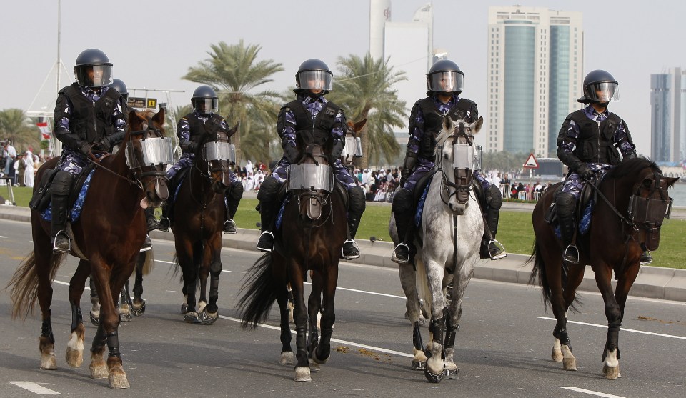 Qatari mounted police take part in a parade