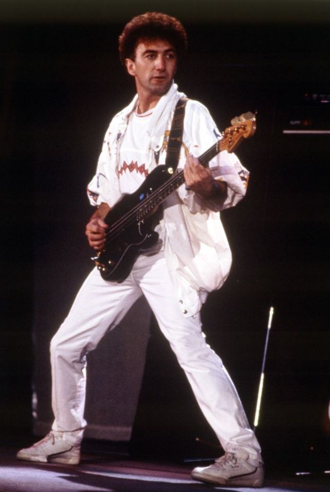 Former Queen bassist John Deacon seen playing at Wembley Stadium back in 1986