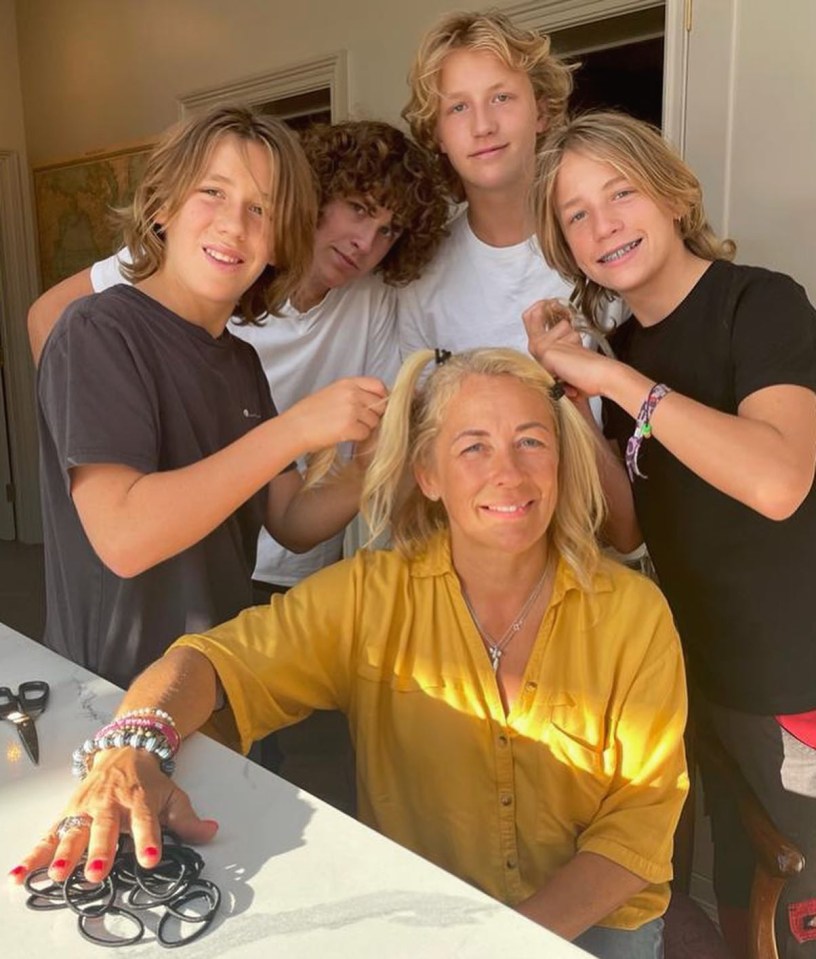 The TV host, pictured with her sons, says a woman having a shaved head is nothing to be ashamed of