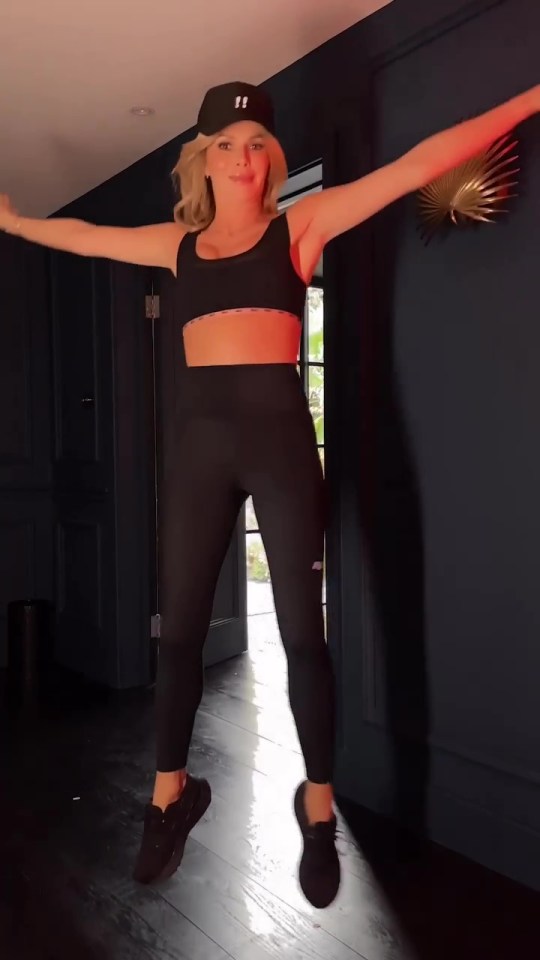 Amanda Holden wowed in an all black gym set as she flashed her abs