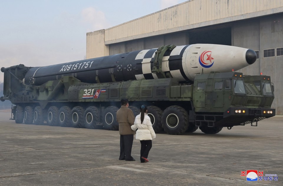 The pair inspected a missile before it was test fired