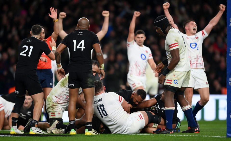 Will Stuart touches down for England’s third try while tackled by Richie Mo’unga