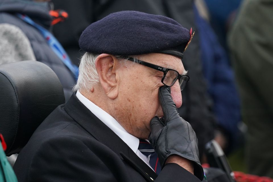 An emotional veteran wipes away a tear at the emotional service