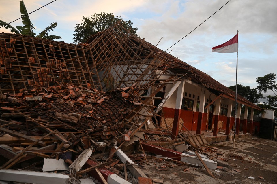 A school building destroyed following the earthquake in Cianju