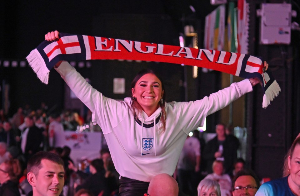 A fan shows off her England scarf at the Winter Gardens, Blackpool