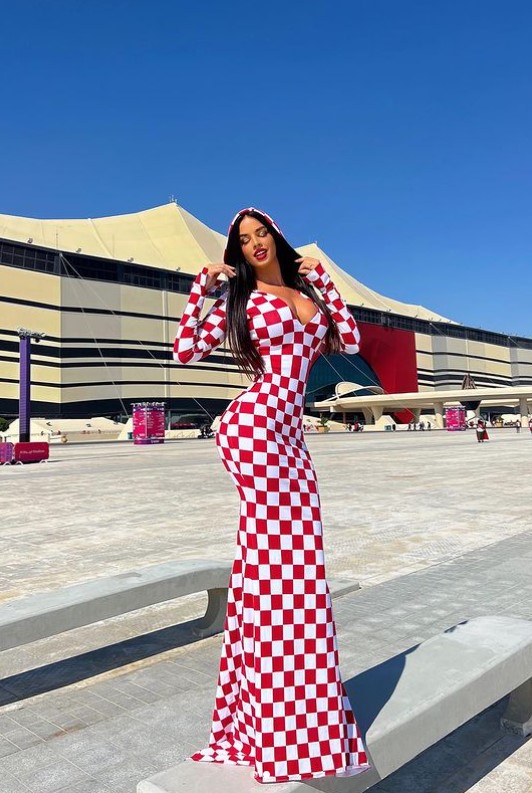 The 30-year-old beauty dared to risk breaking Qatar's strict rules when wearing her figure-hugging ensemble