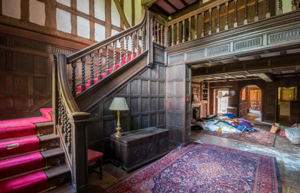 Inside the hallway is decked out in wood panelling