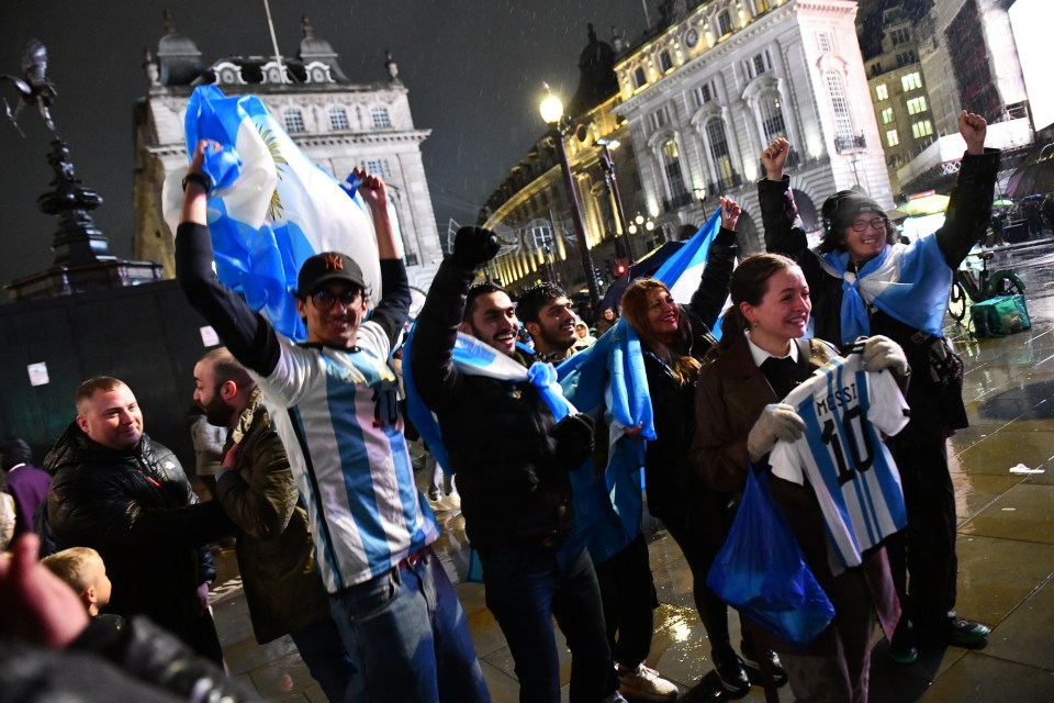 Argentina fans in London's Piccadilly Circus celebrate their first World Cup in 36 years