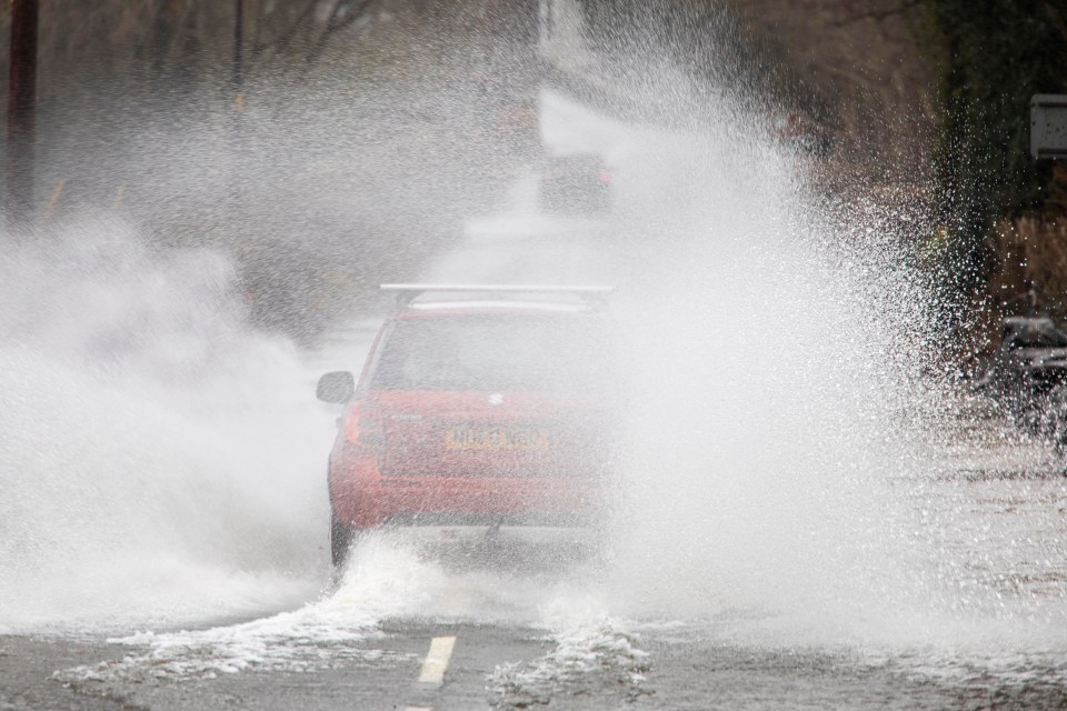 Some motorists decided to chance the floods in North Wales