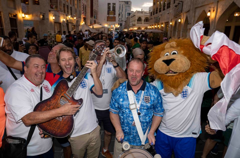 Chesney Hawkes led on guitar as England Band trumpeter John Hemmingham, 59, drummer Steve Holmes, 51, and Sun lion Harry Mane were mobbed