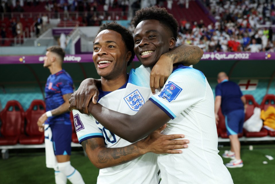 The horrific raid took place on Saturday night - less than 24 hours before England’s clash against Senegal - pictured Sterling with Bukayo Saka