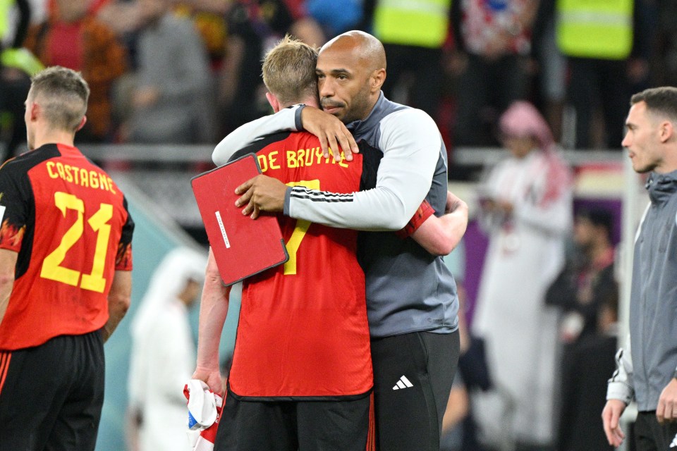 Assistant coach Thierry Henry of Belgium comforts Kevin De Bruyne