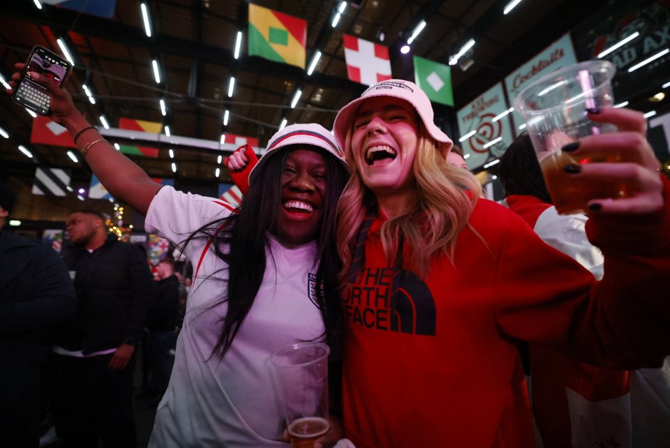 Two smiling supporters in the capital